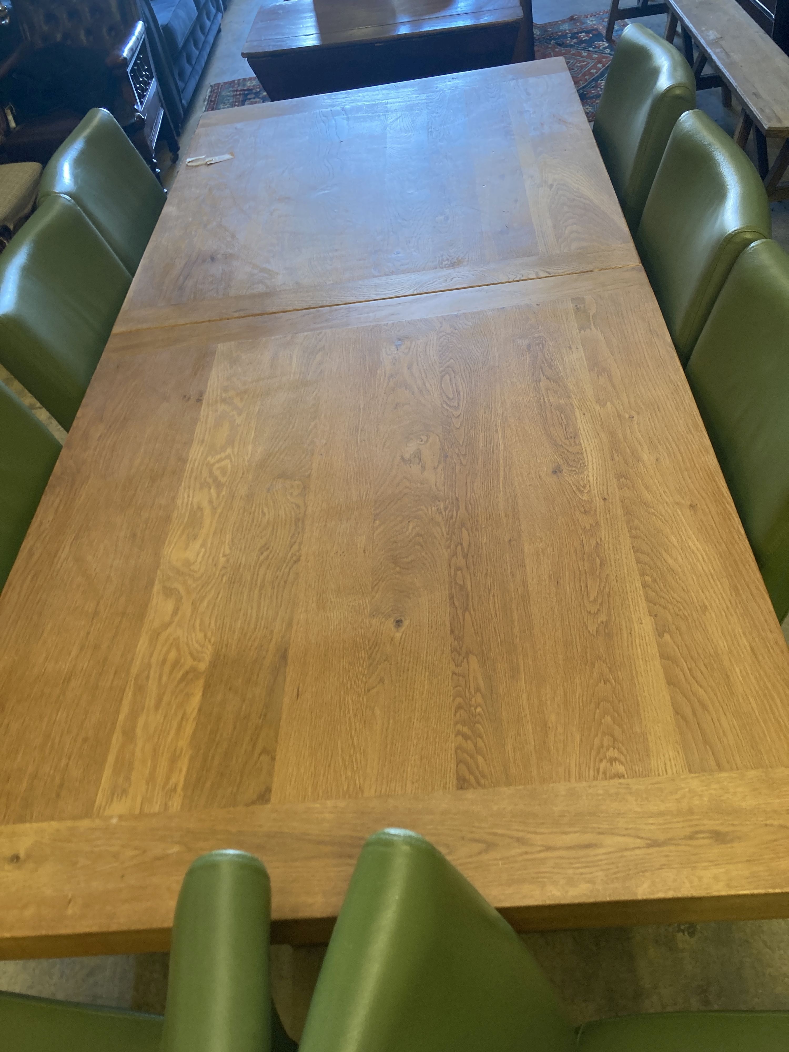 A contemporary oak dining suite,